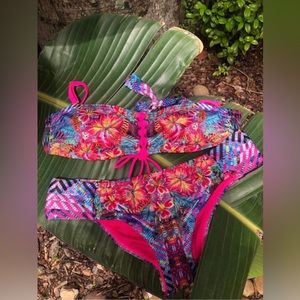 Handcrafted strapless swimsuit with removable straps .
